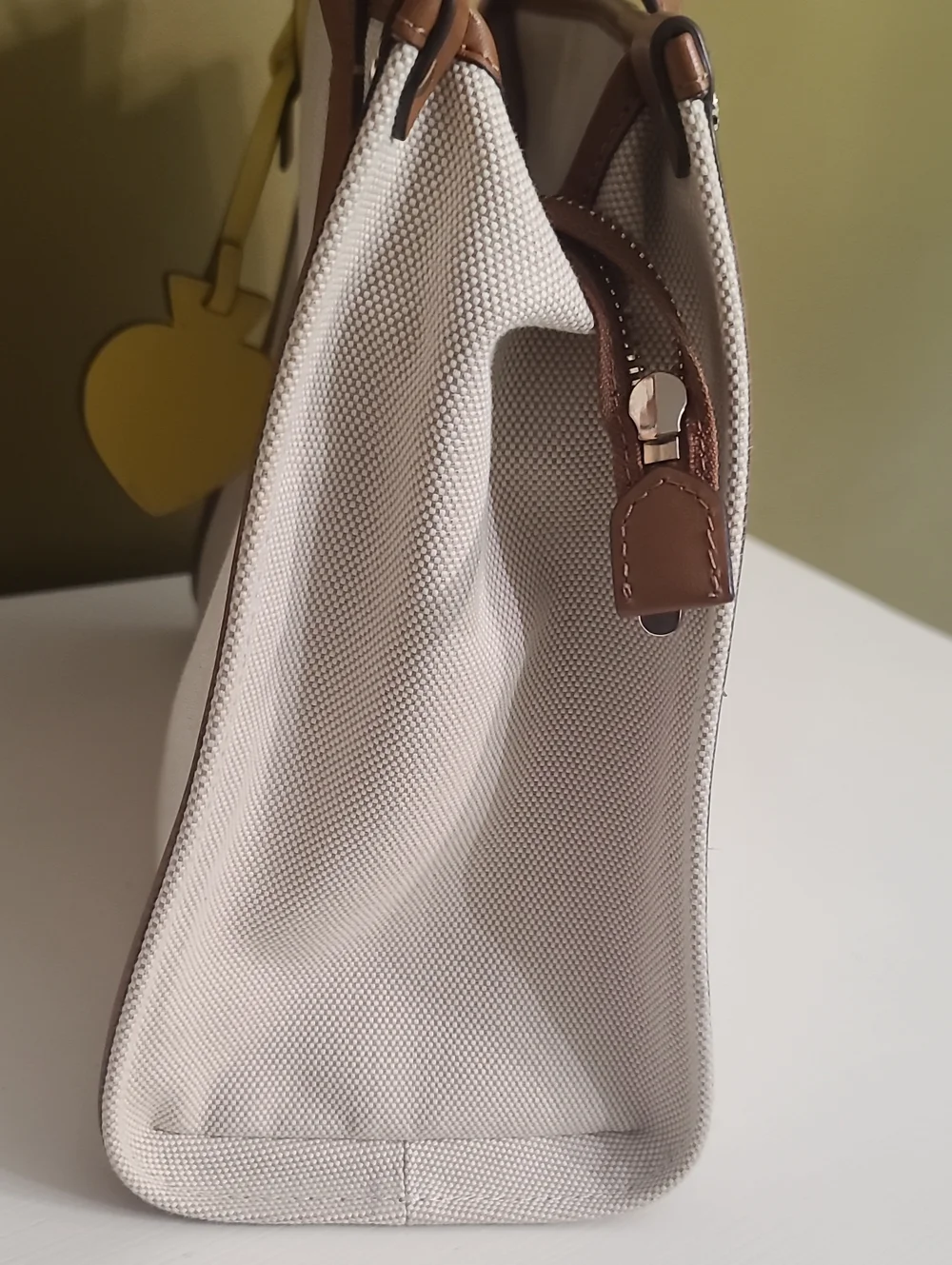 kate spade Beige Canvas Tote with Brown Trim and Yellow Charm